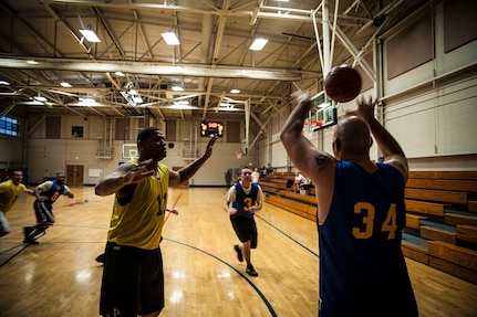 Adrian Johnson, 628th Comptroller Squadron, passes the ball during a game against the 628th Logistics Readiness Squadron Jan. 29, 2013, at Joint Base Charleston, S.C. The 628th LRS beat the 628th CPTS 52 to 46. Games are scheduled to be played on Tuesday, Wednesdays and Thursdays at 5:30, 6:30 and 7:30 p.m. at the Fitness Center at the JB Charleston - Air Base. (U.S. Air Force photo/ Senior Airman Dennis Sloan)