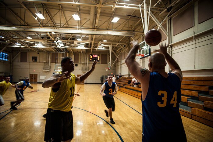 Adrian Johnson, 628th Comptroller Squadron, passes the ball during a game against the 628th Logistics Readiness Squadron Jan. 29, 2013, at Joint Base Charleston, S.C. The 628th LRS beat the 628th CPTS 52 to 46. Games are scheduled to be played on Tuesday, Wednesdays and Thursdays at 5:30, 6:30 and 7:30 p.m. at the Fitness Center at the JB Charleston - Air Base. (U.S. Air Force photo/ Senior Airman Dennis Sloan)