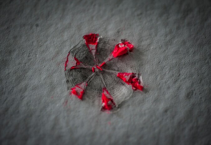 A simunition round fired from an M-9 pistol into a wall by a 628th Security Forces Squadron Airmen leaves an indent and paint residue during a close quarters battle exercise Jan. 28, 2013, at Joint Base Charleston – Air Base, S.C. Simunition rounds are simulated rounds that leave a mark on the target. (U.S. Air Force photo/Senior Airman Dennis Sloan)