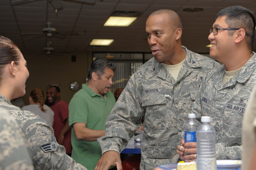 U.S. Air Force Col. Alvis Headen, 23d Medical Group commander, greets Airmen during the Martin Luther King Jr. birthday celebration at Moody Air Force Base, Ga., Jan. 24, 2013. The Spot community center held different activities throughout the facility to honor the civil rights leader, including a singing of “Happy Birthday” from children with the Child Development Center. (U.S. Air Force photo by Senior Airman Eileen Meier/Released)