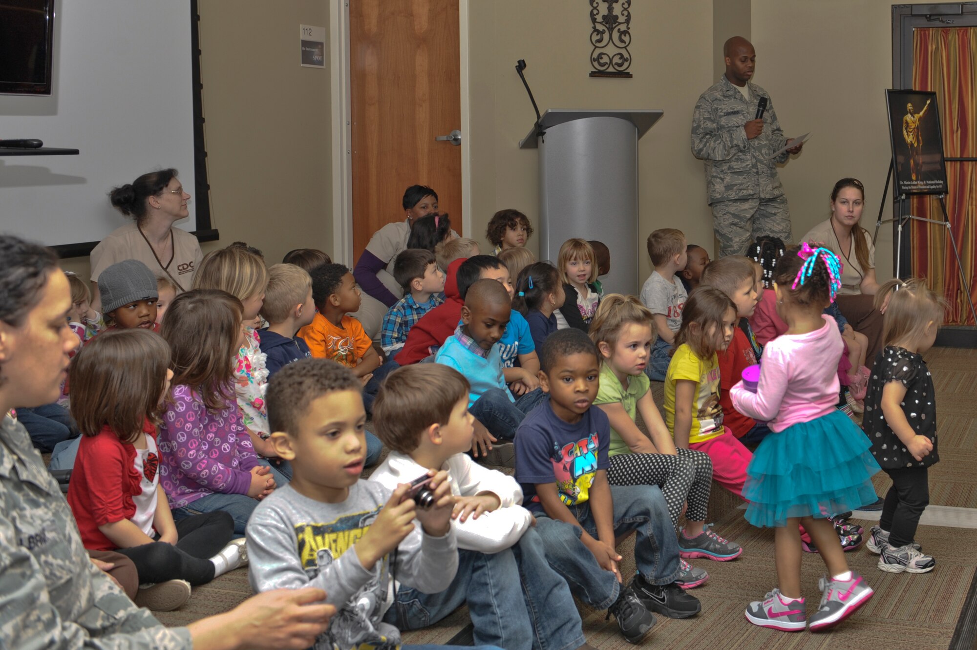 U.S. Air Force 1st Lt. Richard Chapman, 23d Medical Group, gives an introduction before children from the Child Development Center sing “Happy Birthday” to honor Martin Luther King Jr. Day at Moody Air Force Base, Ga., Jan. 24, 2013. The third Monday in January marks the federal holiday that honors the civil rights leader. (U.S. Air Force photo by Senior Airman Eileen Meier/Released)