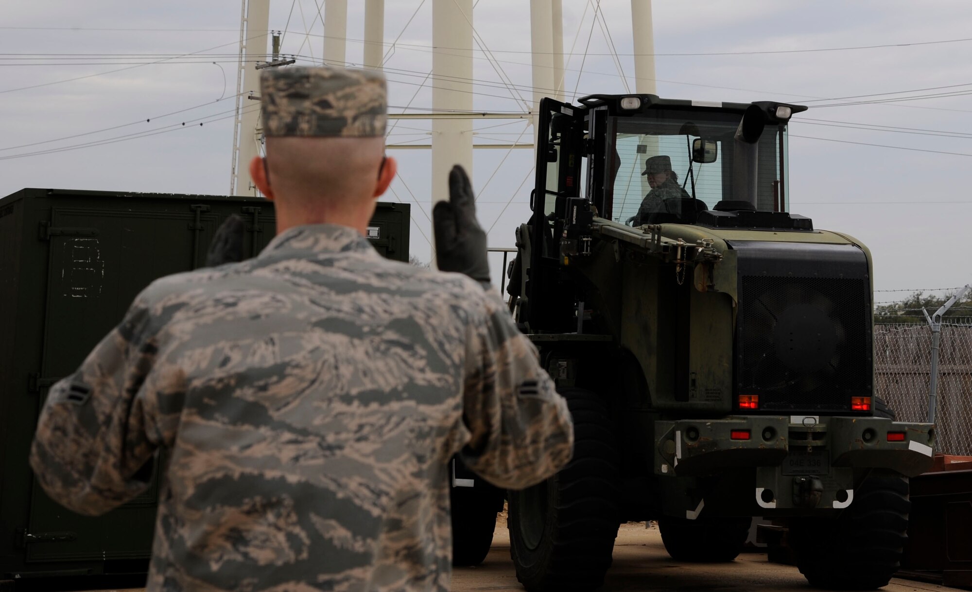 Airman 1st Class Karl Klein, 2nd Logistics Readiness Squadron, provides directions to Airman 1st Class Jaquelyn Mungavin, 2 LRS, as she moves a pallet during fork lift qualifications on Barksdale Air Force Base, Jan. 30. The vehicle operations section provides mission support by providing transportation for aircrew, distinguished visitors, and loading and moving cargo. (U.S. Air Force photo/Airman 1st Class Andrew Moua)