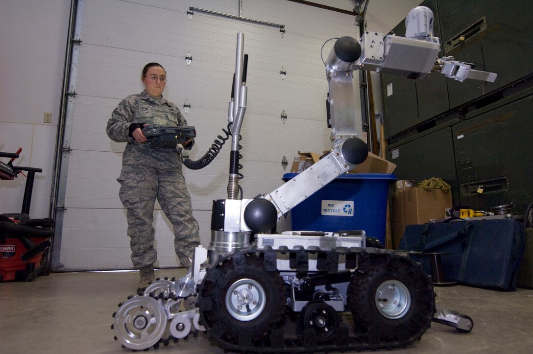 Senior Airman Danee Hicks, 28th Civil Engineer Squadron explosive ordnance disposal journeyman, maneuvers an HD-1 Air Force Medium Size Robot at Ellsworth Air Force Base, S.D., Dec. 20, 2012. The EOD Airmen train monthly to maintain proficiency with maneuvering the robot. (U.S. Air Force photo by Airman 1st Class Audra M. Hornbacher/Released)