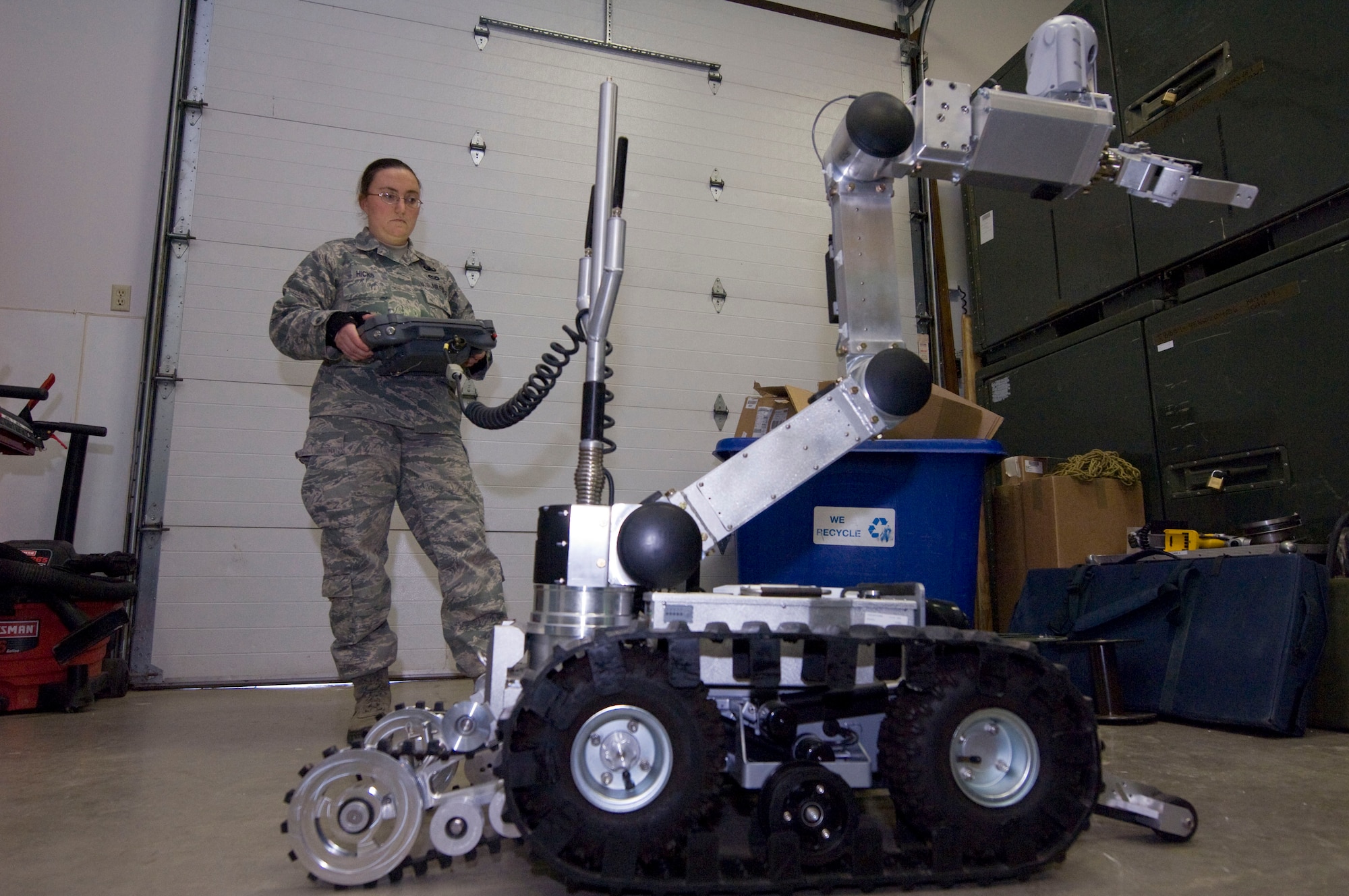Senior Airman Danee Hicks, 28th Civil Engineer Squadron explosive ordnance disposal journeyman, maneuvers an HD-1 Air Force Medium Size Robot at Ellsworth Air Force Base, S.D., Dec. 20, 2012. The EOD Airmen train monthly to maintain proficiency with maneuvering the robot. (U.S. Air Force photo by Airman 1st Class Audra M. Hornbacher/Released)