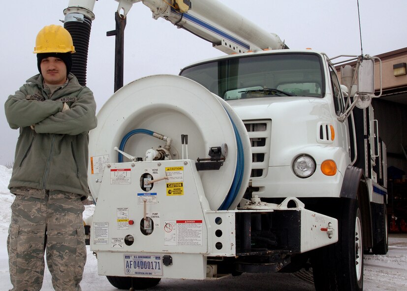 Airman 1st Class Jared Rodgers, a water and fuel system maintenance apprentice with the 319th Civil Engineer Squadron, stands outside of the Jetter truck Jan. 28, 2013 on Grand Forks Air Force Base, N.D. Rodgers was recently appointed to be the lead operator of the truck, which is used to flush out sewer mains and prevent blockings between base buildings and the water treatment lagoons. (U.S. Air Force photo/ Airman 1st Class Zachiah Roberson)