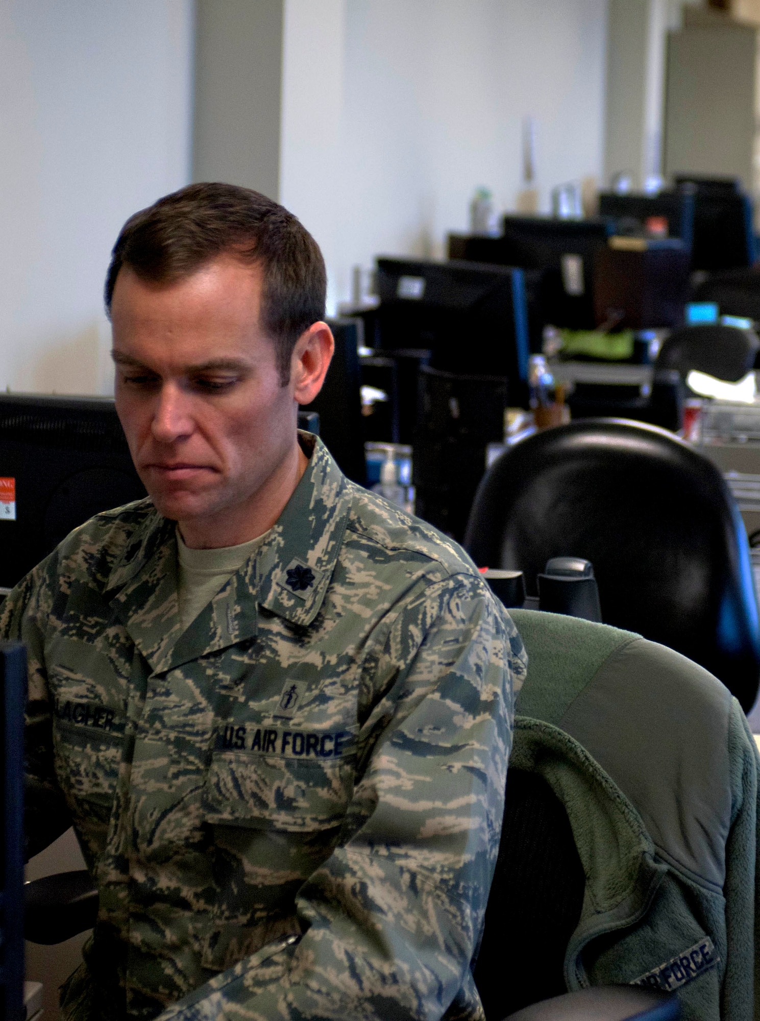 Dr. [Lt. Col.] Joseph Gallagher, 633rd Medical Operations Squadron gastroenterologist, transcribes notes from previous appointments in the new multiservice clinic Jan. 23, 2013, in U.S. Air Force Hospital Langley, Langley Air Force Base, Va. According to the U.S. Department of Health and Human Resources, 60 to 70 million people are affected by digestive diseases, and account for 13.5 million hospitalizations yearly. (U.S. Air Force photo by Airman 1st Class R. Alex Durbin/Released)