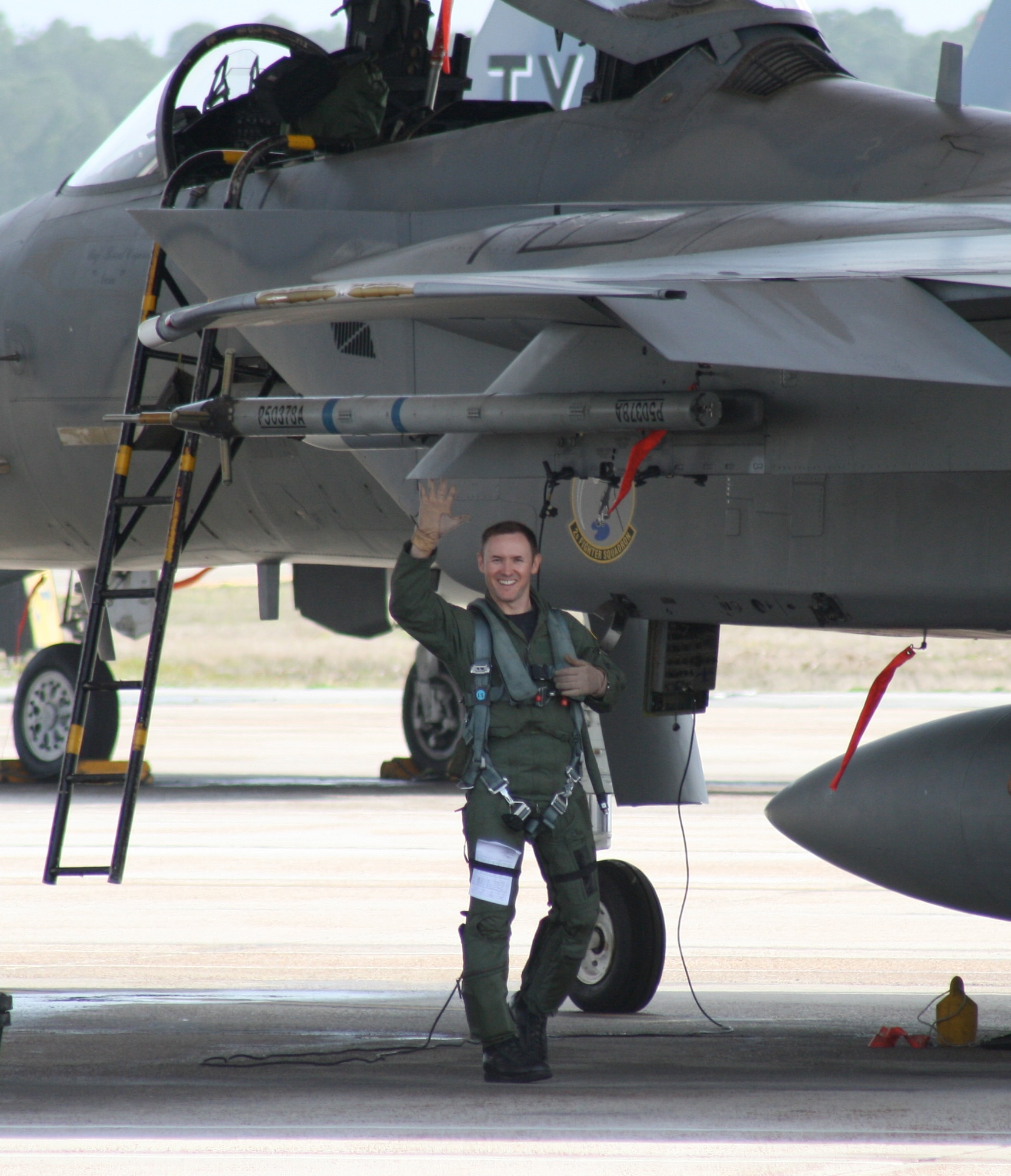 Lt. Col. (Dr.) Jay Flottmann, a former flight surgeon and now fully qualified F-22 Raptor pilot and 325th Fighter Wing chief of flight safety, shown here with an F-15 Eagle, is the first pilot-physician to drive the F-22. (Courtesy photo)  