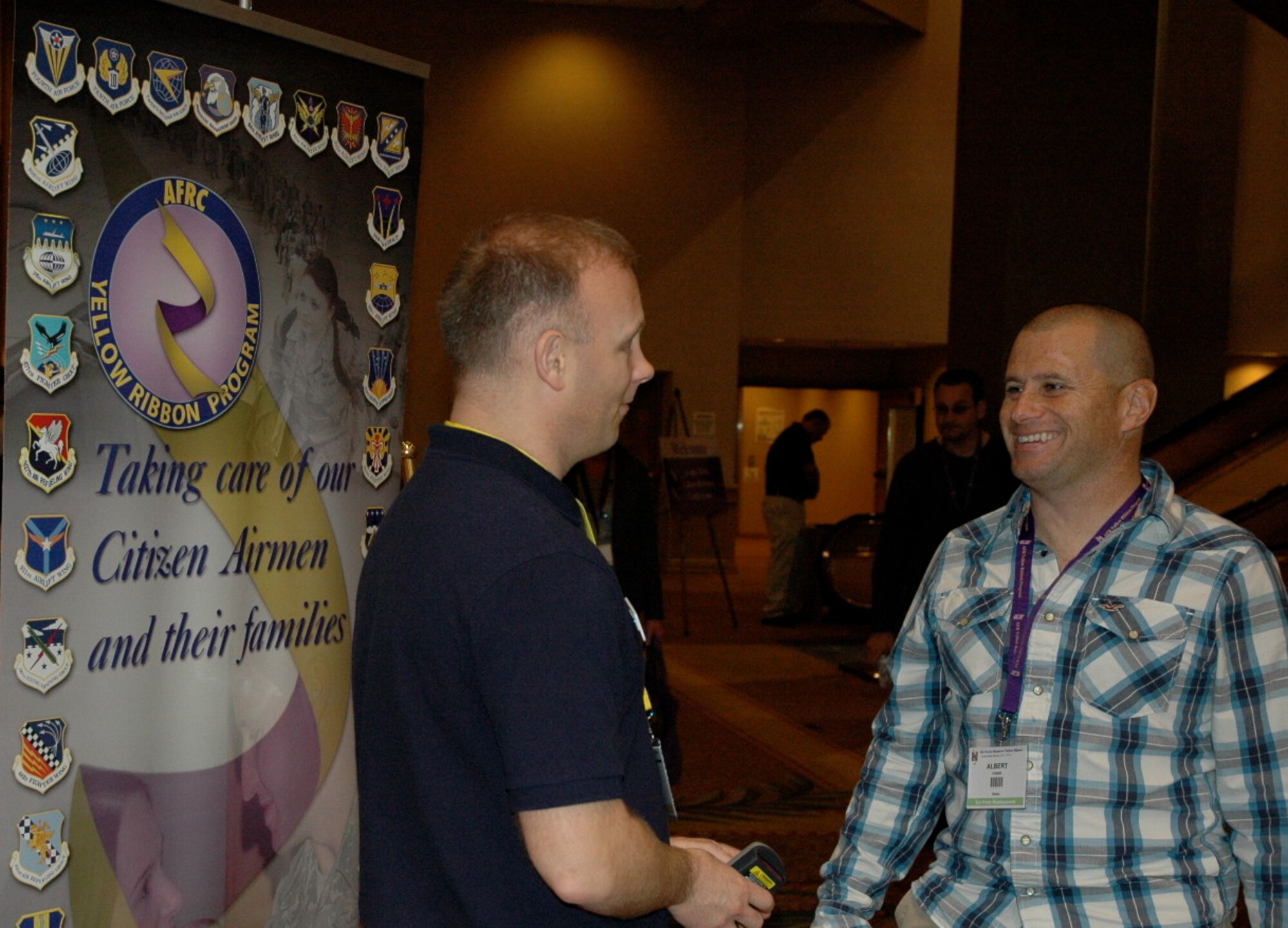 Major Todd Guiney (left), the 940th Wing Yellow Ribbon Representaive and Tech Sergeant Albert Fanini meet during the Yellow Ribbon event in Costa Meas Jan 25-27. TSgt Fanini recently returned from a deployment to Afghanistan and attended the event with his wife Colleen.(U.S. Air Force Photo Capt. Joe Simms)