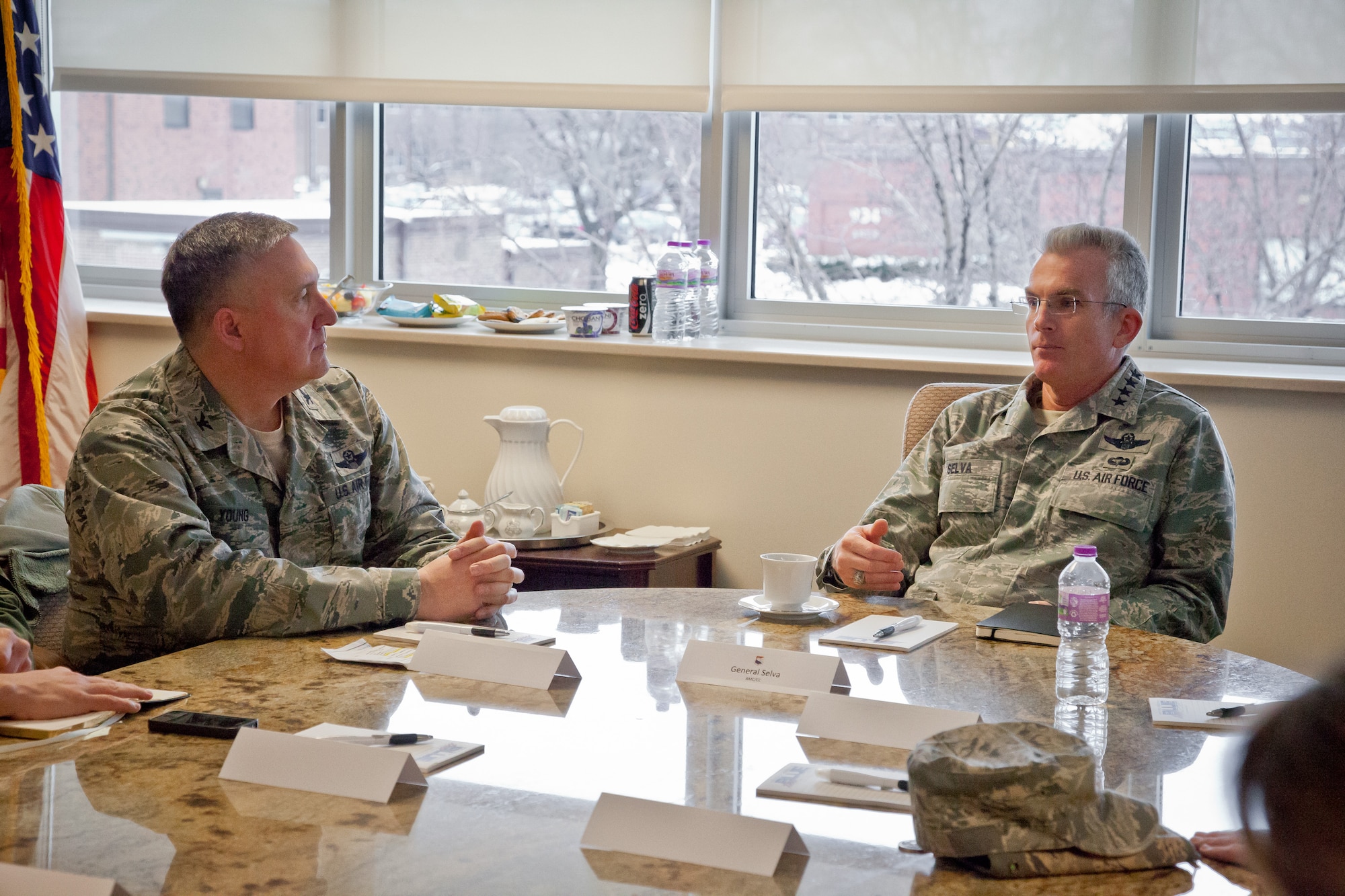 Gen. Paul J. Selva, Air Mobility Command commander, speaks with Col. Darrell G. Young, 934th Airlift Wing commander, during his visit to the Minneapolis-St. Paul Air Reserve Station, Minn. (U.S. Air Force Photo/Shannon McKay)