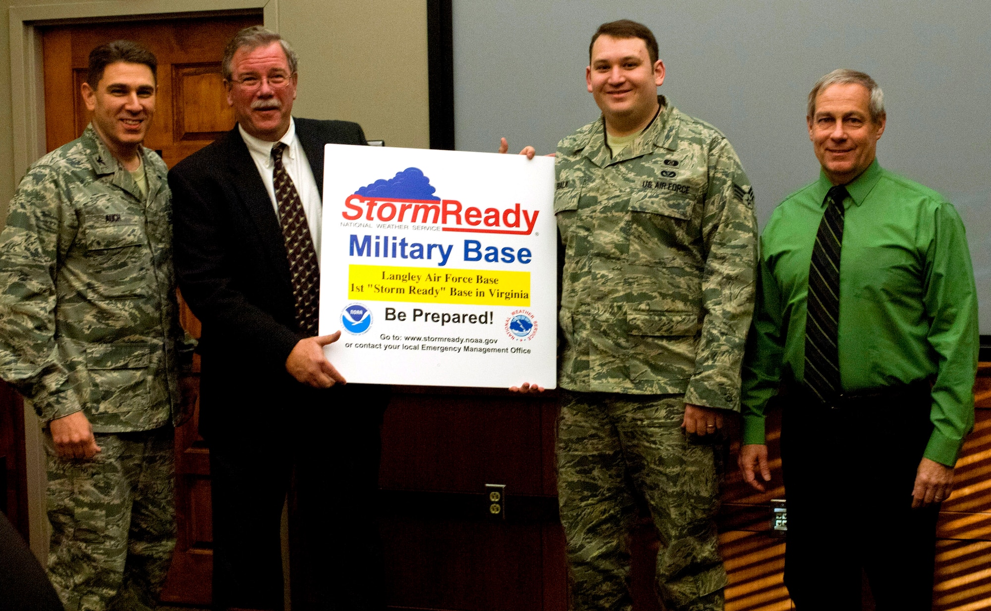 (From left to right) Col. Korvin Auch, 633rd Air Base Wing commander, Bill Sammler, National Weather Service warning coordination meteorologist, Senior Airman Evan Bialk, 633rd Civil Engineer Squadron emergency manager, and Chris Born, 633rd CES readiness flight chief, display a Storm Ready sign signifying Langley’s dedication to safety, earned through months of preparation and effort from several departments base-wide, Jan. 23, 2013, at Langley Air Force Base, Va. Storm Ready is a voluntary, nationwide program that helps prepare communities for severe weather with the communication and safety skills needed to save property and lives. (U.S. Air Force photo by Airman 1st Class R. Alex Durbin/Released)