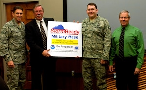 (From left to right) Col. Korvin Auch, 633rd Air Base Wing commander, Bill Sammler, National Weather Service warning coordination meteorologist, Senior Airman Evan Bialk, 633rd Civil Engineer Squadron emergency manager, and Chris Born, 633rd CES readiness flight chief, display a Storm Ready sign signifying Langley’s dedication to safety, earned through months of preparation and effort from several departments base-wide, Jan. 23, 2013, at Langley Air Force Base, Va. Storm Ready is a voluntary, nationwide program that helps prepare communities for severe weather with the communication and safety skills needed to save property and lives. (U.S. Air Force photo by Airman 1st Class R. Alex Durbin/Released)