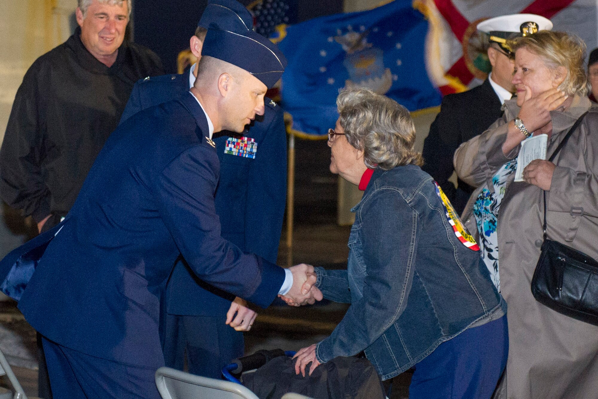 Col. Robert Pavelko, vice commander, 45th Space Wing, offers his condolences to Mrs. Betty Grissom, wife of Astronaut Gus Grissom at the Apollo 1 ceremony held on Launch Complex 34 on Cape Canaveral Air Force Station. (U.S. Air Force Photo/ Matthew Jurgens)
