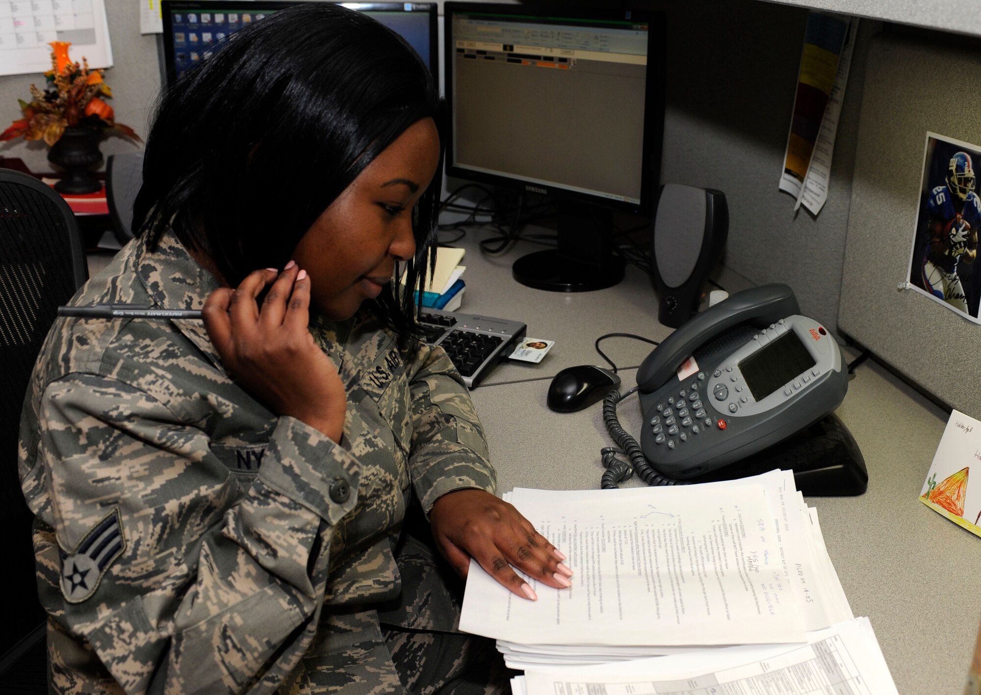 Senior Airman Antionette Nyambo, 28th Force Support Squadron Military Personnel Section customer support technician, revises an Airman's in-processing paperwork in the MPS at Ellsworth Air Force Base, S.D., Jan. 24, 2013. Ellsworth's MPS placed first in the entire U.S. Air Force for their 94 percent on-time rate for enlisted and officer performance reports and for their commitment to all other aspects of their mission. (U.S. Air Force photo by Airman Ashley J. Thum/Released)
