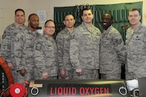MINOT AIR FORCE BASE, N.D. -- The 5th Maintenance Squadron's Electro-Environmental Section has 13 technicians who support multiple agencies on Minot Air Force Base to include the 91st Missile Wing, 5th Operations Group and 5th Maintenance Group. They service and repair 19 liquid and gaseous oxygen carts. These carts provide Minot's B-52H Stratofortress fleet with breathing oxygen, essential to high-altitude flight.  Additionally, they perform major inspections and maintenance on the 5th Bomb Wing's B-52H aircraft and 91st MW's UH-1 helicopters. Finally, they maintain 28 life raft inflation assemblies which are essential to aircrew emergency evacuation. (Photo courtesy of the Command Chief's Office)