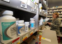 Capt. Christine Cox, 21st Medical Squadron pharmacist and support flight commander, reviews her notes Jan. 28 at the base pharmacy. The pharmacy's mission is to provide medication services to active-duty members, which include getting them ready to deploy and keeping them healthy. Also, they provide services to dependents and retirees. (U.S. Air Force photo/Staff Sgt. Julius Delos Reyes)