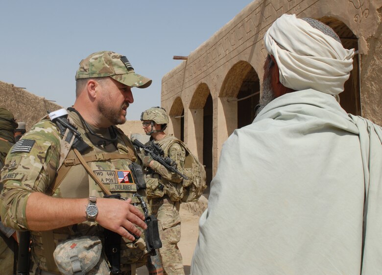 Dr. William Dulaney, the Air Force Culture and Language Center’s  professor of organizational communication, talks with a village malik, or mayor, near Shindand Air Base, Afghanistan, during a recent assessment visit for the Air Advisor Academy.
(courtesy photo)
