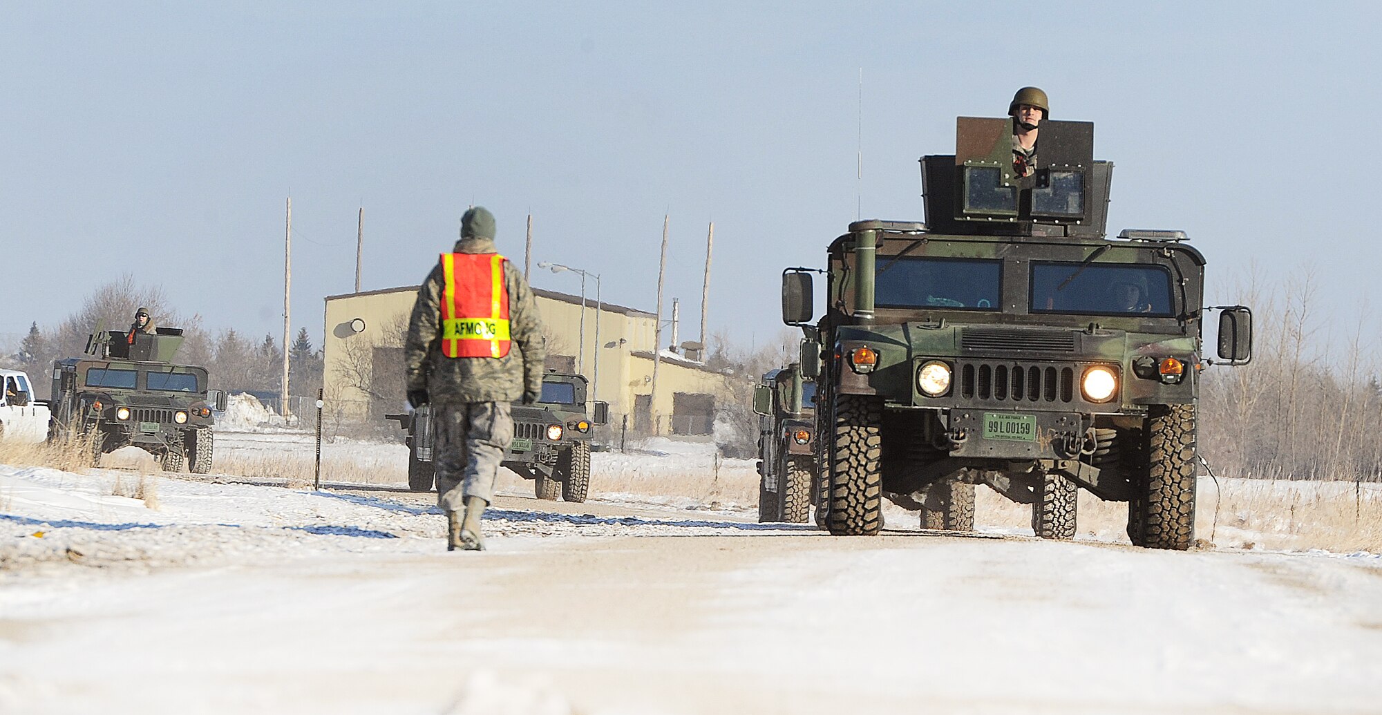 MINOT AIR FORCE BASE, N.D. -- A group of vehicle operators assigned to the 5th Logistics Readiness Squadron drive to their next check point during convoy training here, Jan. 26. The Airmen underwent an elaborate convoy training program designed to teach critical defensive and safety procedures during potential threats when running convoy operations. (U.S. Air Force photo/Senior Airman  Brittany Y. Auld)