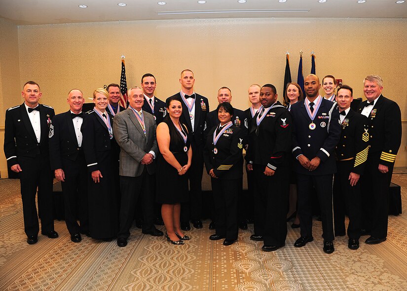 Joint Base Charleston annual award winners gather with JB Charleston leadership after the 628th Air Base Wing Annual Awards Banquet at the Charleston Club, Jan. 25, 2013, at JB Charleston - Air Base, S.C.  (Left to right) Col. Richard McComb, JB Charleston commander; Chief Master Sergeant Al Hannon, 628th ABW command chief; 2nd Lt. Merry Miller,  628th Logistics Readiness Squadron officer in charge of deployments; Michael Heckendorn, 628th Communications Squadron telecommunications project manager; Jeffrey Garrett, 628th Civil Engineer Squadron chief of asset management flight; Senior Airman Bryan Queen, 628th Logistics Readiness Squadron fuels fixed facility supervisor; Beth Dixon, 628th Security Forces Squadron unit program coordinator; Master Sgt. Scott Levesque, 628th CS plans and programs flight superintendent; Master Sgt. Randall Fontenont, 628th CES first sergeant; Petty Officer 1st Class Jinnett Santos, Naval Activity Support culinary ; Petty Officer 2nd Class David Haeffner ; Petty Officer 3rd Class Darnell Kleckley, Naval Activity Support culinary specialist; Tech. Sgt. Kristen Schmalz, 628th Air Base Wing noncommissioned of command post operation; Senior Airman Antonio Hill, 628th LRS vehicle management analysis; and Airman 1st Class Jonna Kienzl, 628th Medical Group dental assistant, Master Chief Petty Officer Billy Cady, JB Charleston – Weapons Station command master chief, and Captain Thomas Bailey, JB Charleston deputy commander.  Not pictured is Capt. Darnell Schuettler , 628th MDG psychologist, won the Senior Grade Officer of the Year award. (U.S. Air Force photo/Staff Sgt. Rasheen Douglas)