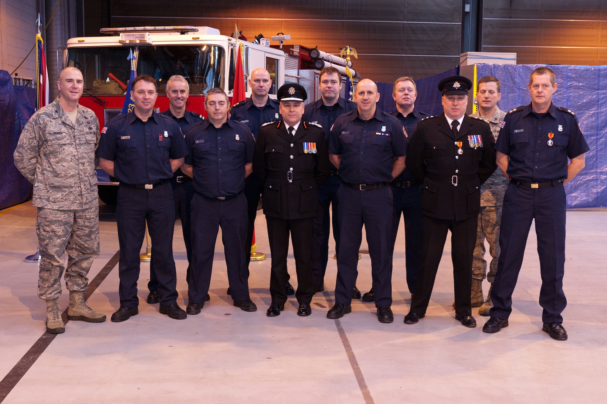 RAF ALCONBURY, United Kingdom – Defence Fire Risk Management Organisation Chief Fire Officer Phil Salt, the top fire officer in the Ministry of Defence, presented three 423rd Civil Engineer Squadron firefighters with the Fire and Rescue Service Long Service and Good Conduct Medal on behalf of Her Majesty the Queen during a ceremony at the RAF Alconbury Fire Department Jan. 24. In addition to the Fire and Rescue Service Long Service and Good Conduct Medals Salt presented other awards and certificates to members of the 423rd CES/FD at RAF Alconbury and RAF Molesworth. (U.S. Air Force photo by Staff Sgt. Brian Stives)