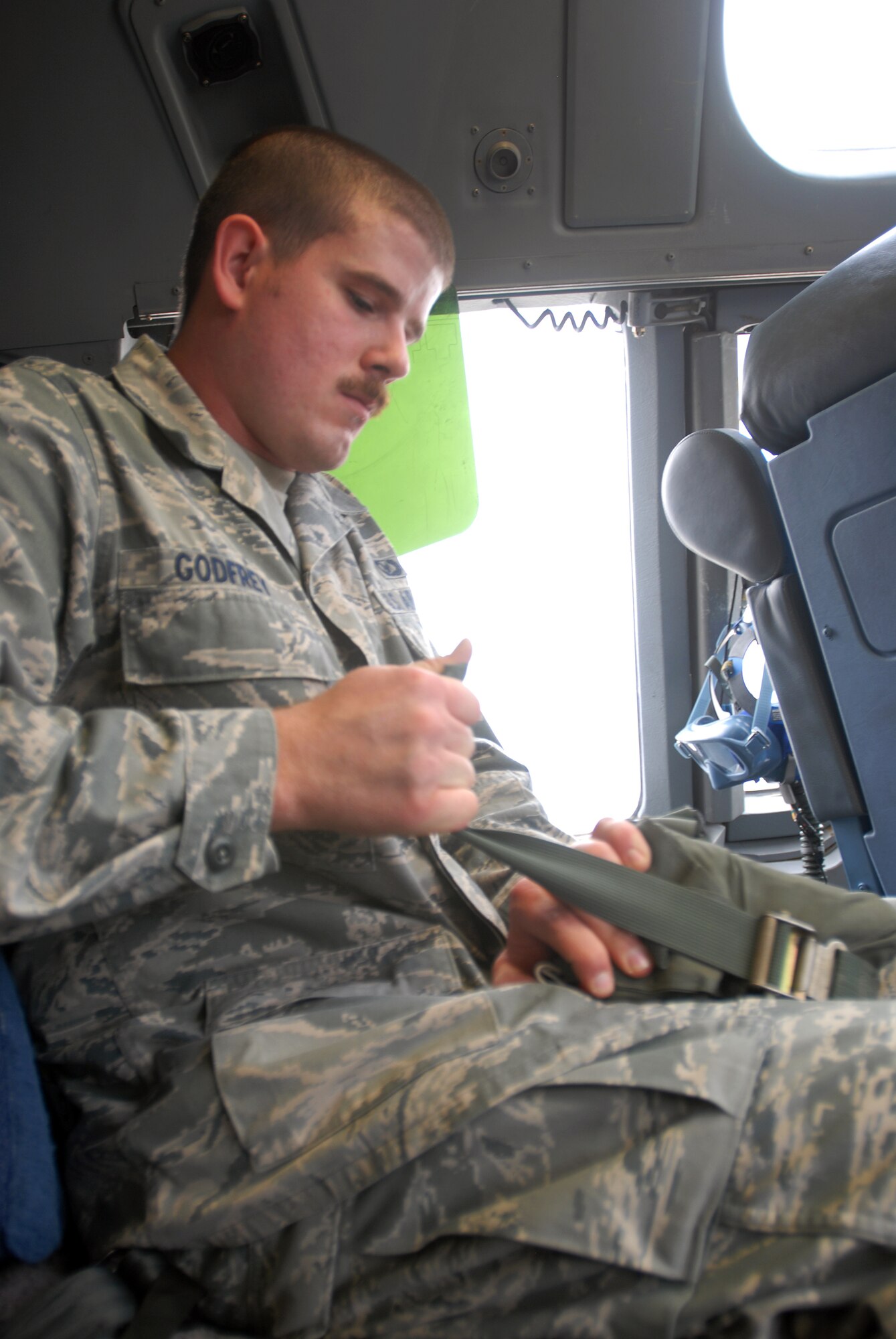 SOUTHWEST ASIA -- Senior Airman Daniel Godfrey, Aircrew Flight Equipment lead, inspects aircrew life preservers stored in the cockpit of the C-17. The 816th Expeditionary Airlift Squadron Aircrew Flight Equipment office maintains life-saving equipment for pilots and loadmasters on the C-17A Globemaster III at an undisclosed location Southwest Asia.(U.S. Air Force photo/Master Sgt. Christian Michael)