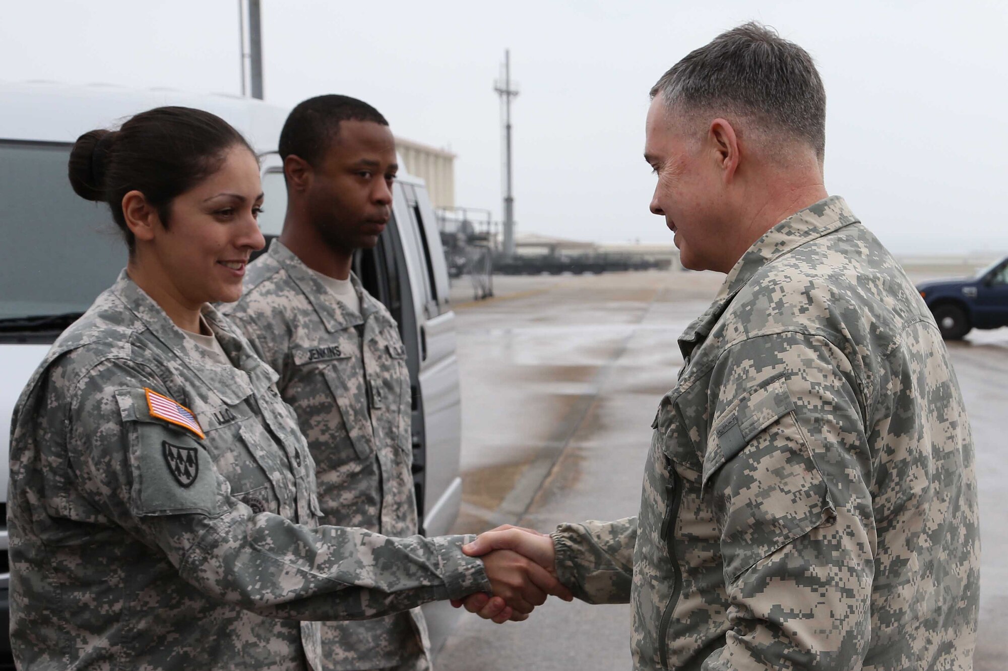 U.S. Army Lt. Gen. William N. Phillips greets U.S. Army Sgt. 1st Class. Diana Ulloa, 1st Air Defense Artillery Regiment operations NCO in charge, and U.S. Army Staff Sgt. Bobby Jenkins, 1st Air Defense Artillery Regiment projects NCO in charge, during his visit to Kadena Air Base, Japan, Jan. 22, 2013. Phillips is the Principal Military Deputy, Assistant Secretary of the Army, Acquisition, Logistics and Technology Director, Acquisition Career Management. (U.S. Air Force photo/Staff Sgt. Darnell T. Cannady)