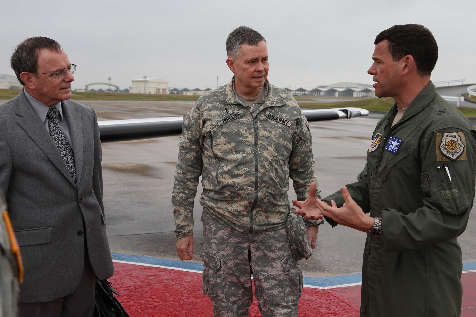 U.S. Air Force Brig. Gen. Matt Molloy, 18th Wing commander, speaks with U.S. Army Lt. Gen. William N. Phillips during his visit to Kadena Air Base, Japan, Jan. 22, 2013. Phillips is the Principal Military Deputy, Assistant Secretary of the Army, Acquisition, Logistics and Technology Director, Acquisition Career Management. He visited soldiers from the 1st Battalion 1st Air Defense Artillery Regiment here to take a look at their equipment. (U.S. Air Force photo/Staff Sgt. Darnell T. Cannady)