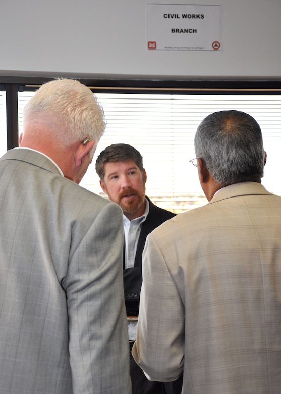 PHOENIX - Drew Savage, a project manager with the U.S. Army Corps of Engineers Los Angeles District's Arizona/Nevada Area Office, speaks with business representatives during the first Business Opportunities Open House held Jan. 29 at the Phoenix office. The event was an open forum designed to let business owners learn about contract opportunities and to learn how to do business with the Corps. 