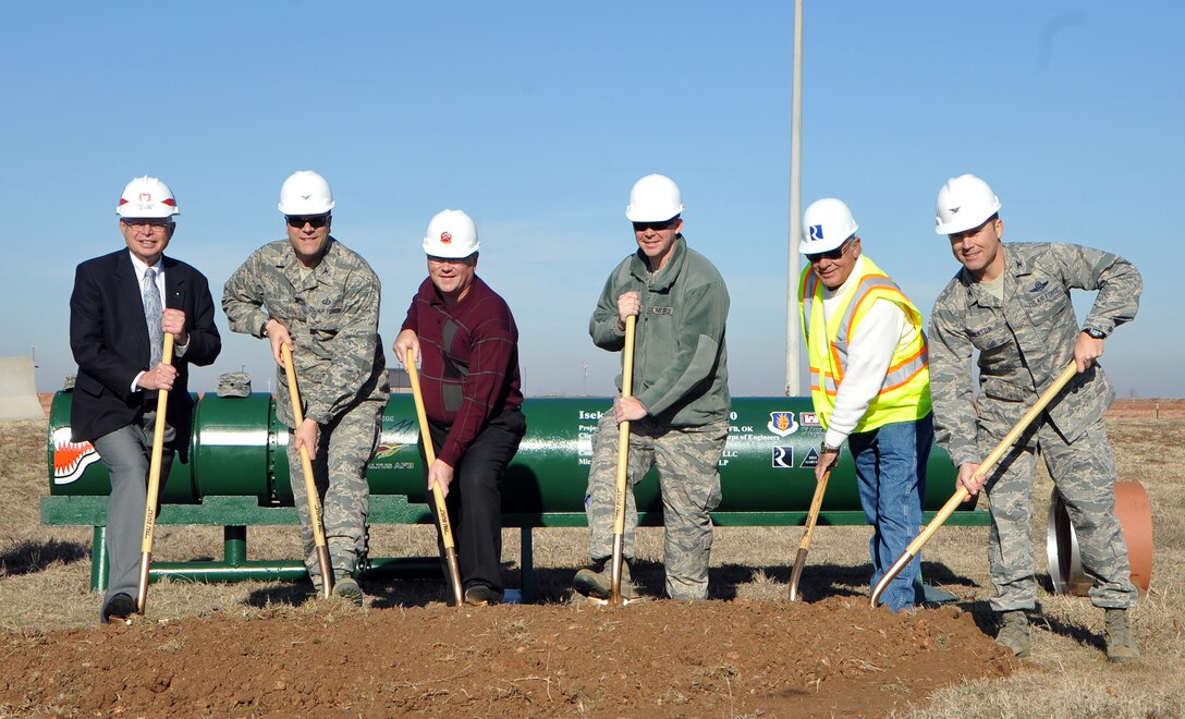 ALTUS AIR FORCE BASE, Okla. – Members of the U.S. Army Corps of Engineers, Reliable Contracting Group, and Altus AFB pose for a picture at the Jet Propellant 8 Fuel Transfer Line groundbreaking, Jan. 23. The groundbreaking was held to kick-off the reestablishment of a steel pipeline, which will connect the bulk fuel storage area to the tanker ramp providing a reliable and efficient way to refuel KC-135 Stratotankers. The fuel line is projected to cost more than $9 million and will save the base money over time through saved man hours and truck deliveries