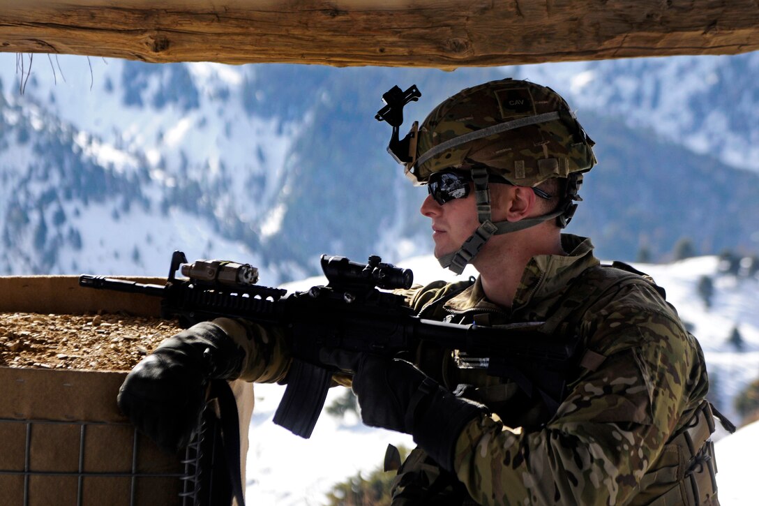 U.S. Army 1st Lt. Ian Richardson provides security at Observation Point 12 along the Afghanistan-Pakistan border in Kunar province, Afghanistan, Jan. 21, 2013. Richardson, an operations officer, is assigned to the 101st Airborne Division's 1st Brigade Combat Team.