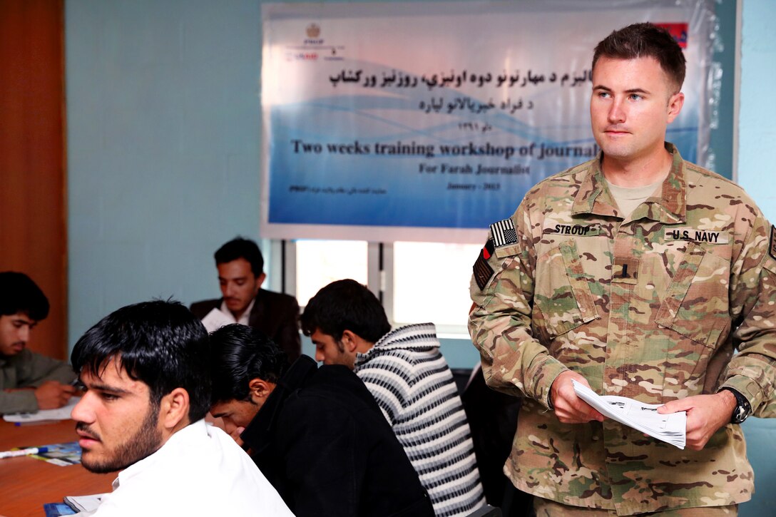 U.S. Navy Lt. j.g. Matthew Stroup begins a photojournalism session at the Directorate of Information and Culture building in Farah City, Afghanistan, Jan. 30, 2013. Stroup, a public affairs officer, is assigned to Provincial Reconstruction Team Farah. 