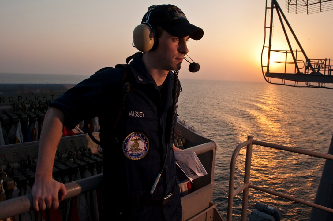 U.S. Navy Intelligence Specialist 3rd Class Ross Massey stands on intelligence watch during the transit of the Strait of Hormuz aboard the aircraft carrier USS John C. Stennis (CVN 74) while in the Strait of Hormuz, Sept. 20, 2011. John C. Stennis was deployed to the U.S. 5th Fleet area of responsibility conducting maritime security operations and support missions as part of operations Enduring Freedom and New Dawn.