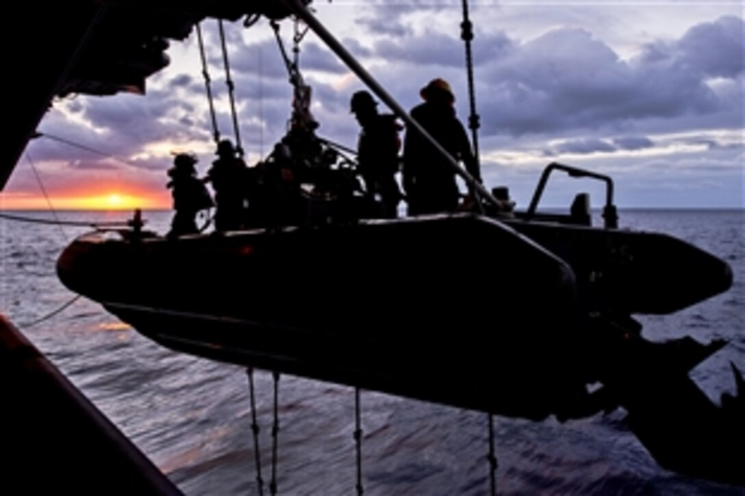 A search and rescue team aboard the aircraft carrier USS Harry S. Truman launches a rigid hull inflatable boat during a man-overboard drill in the Atlantic Ocean, Jan. 29, 2013. The Truman is conducting a composite training unit exercise to prepare for its upcoming deployment.