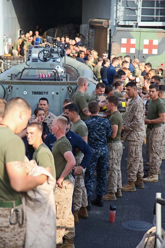 Marines and sailors aboard the USS Rushmore conduct a replenishment-at-sea, Jan. 21. The 15th Marine Expeditionary Unit is deployed as part of the Peleliu Amphibious Ready Group as a U.S. Central Command theater reserve force, providing support for maritime security operations and theater security cooperation efforts in the U.S. 5th Fleet area of responsibility. (U.S. Marine Corps photo by Cpl. Timothy R. Childers)