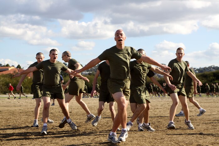 Recruits of Company L, 3rd Recruit Training Battalion, perform cariocas, a calisthenic exercise, during physical training, aboard Marine Corps Recruit Depot San Diego, Jan. 28.  Recruits did calisthenics  during the PT session to help increase agility and speed.