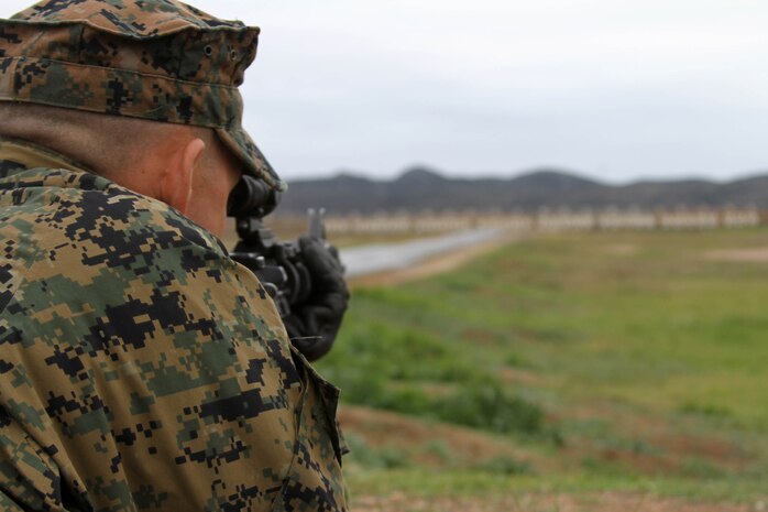 A Company K recruit lies in the prone position and aims down-range at the 500-yard targets at Edson Range, Marine Corps Base Camp Pendleton, Calif., Jan. 24. The recruits are given 10 minutes to make 10 shots from this distance.