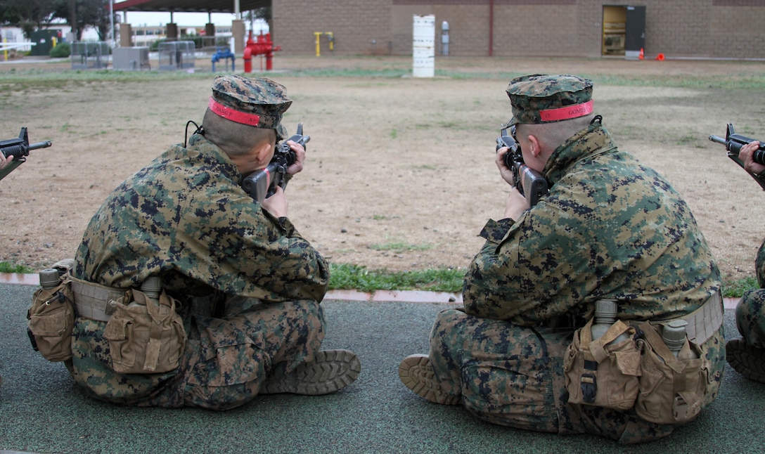 Recruits of Company C, 1st Recruit Training Battalion, sight in on a barrel during Grass Week aboard Edson Range, Marine Corps Base Camp Pendleton, Calif., Jan. 24.