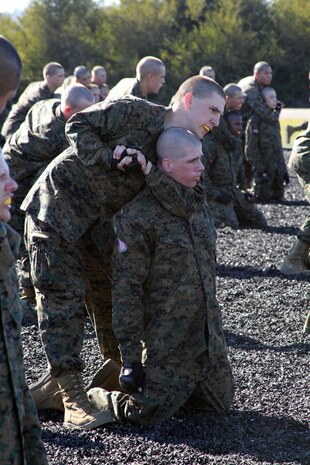 A recruit of Company C, 1st Recruit Training Battalion, performs a rear choke during a Marine Corps Martial Arts Program session aboard Marine Corps Recruit Depot San Diego Jan. 14. The rear choke is a blood choke, which restricts blood flow to the brain, causing the enemy to pass out faster. Recruits learn these techniques in order to quickly control a situation using the least amount of force.