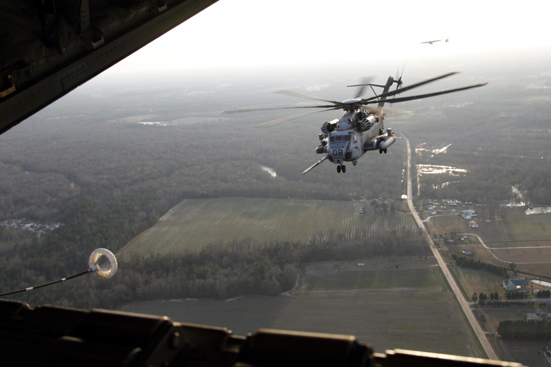 A CH-53E Super Stallion with Marine Heavy Helicopter Squadron 366 approaches the aircraft during a training exercise over eastern North Carolina Jan. 24. HMH-366 operated with Marine Aerial Refueling Transport Squadron 252 in an exercise that focused on aerial refueling, aircraft carrier landings and assaulting hostile positions.