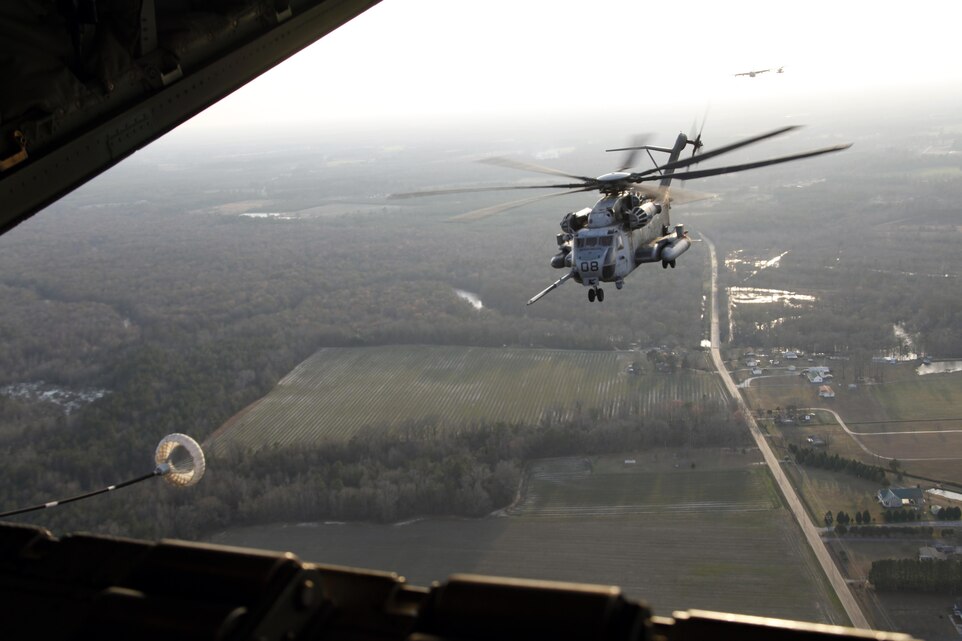 A CH-53E Super Stallion with Marine Heavy Helicopter Squadron 366 approaches the aircraft during a training exercise over eastern North Carolina Jan. 24. HMH-366 operated with Marine Aerial Refueling Transport Squadron 252 in an exercise that focused on aerial refueling, aircraft carrier landings and assaulting hostile positions.