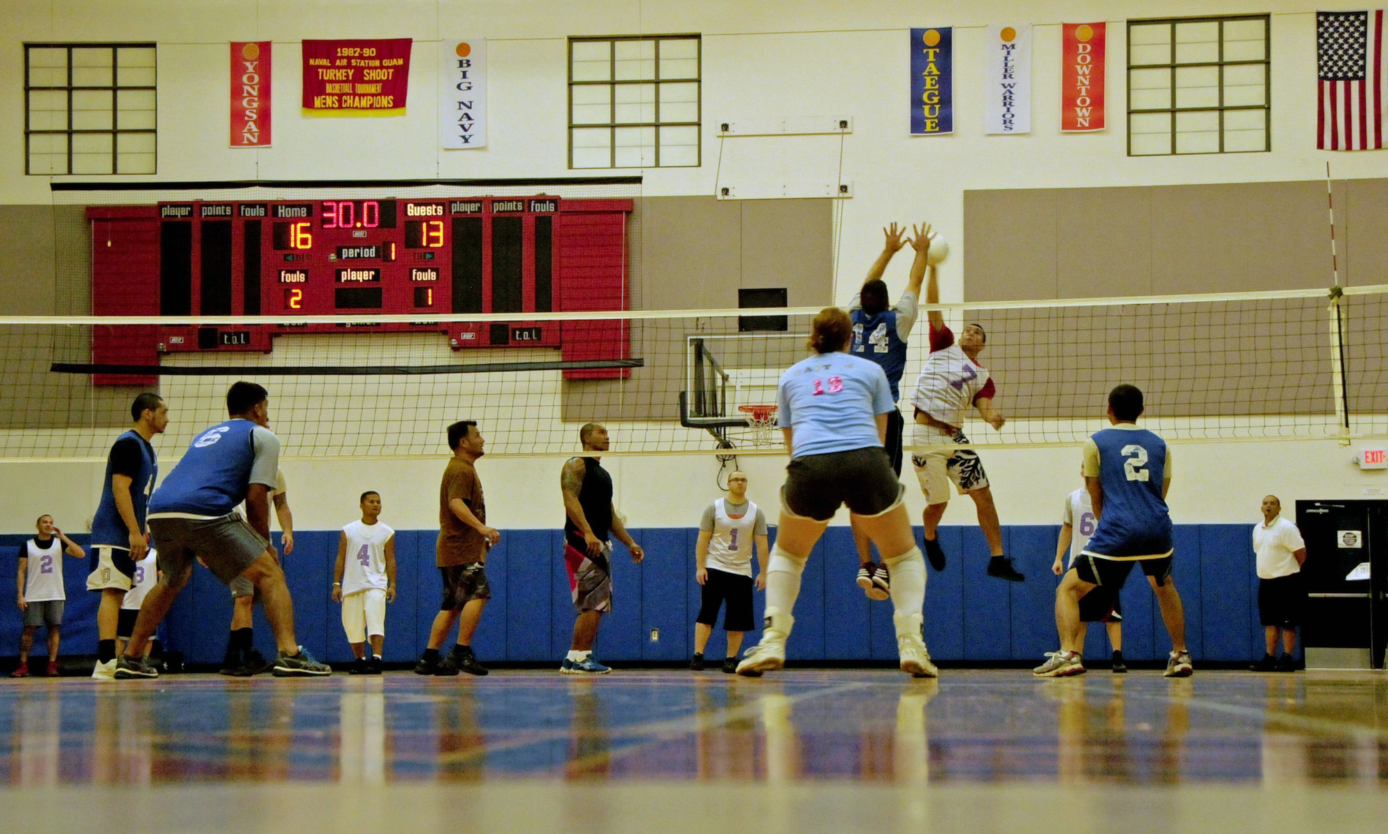 James Dela Pena, 36th Operation Support Squadron volleyball team member, spikes the ball during the intramural volleyball championship game against the 36th Force Support Squadron at Andersen Air Force Base, Guam, Jan 28, 2013. The 36th OSS emerged victorious against the 36th FSS in the final game of this season. (U.S. Air Force photo/Airman 1st Class Marianique Santos/Released)