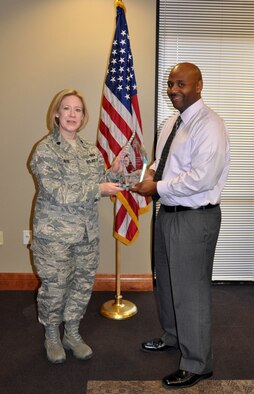 (Right) Dwayne Jackson, 926th Force Support Squadron anti-terrorism officer and security manager, receives Air Force Reserve Command's 2012 Outstanding Security Forces Civilian Support Staff award from Lt. Col. Connie Alge, 926th FSS commander, here Jan. 31. Jackson was recognized for leading all security programs for seven squadrons and two detachments in AFRC's fastest growing group, while additionally performing as the point of contact for force protection, operational security and emergency management. Jackson also managed more than 400 security clearances with a 100 percent on time rate, among many other accomplishments. (U.S. Air Force photo/Maj. Jessica Martin)