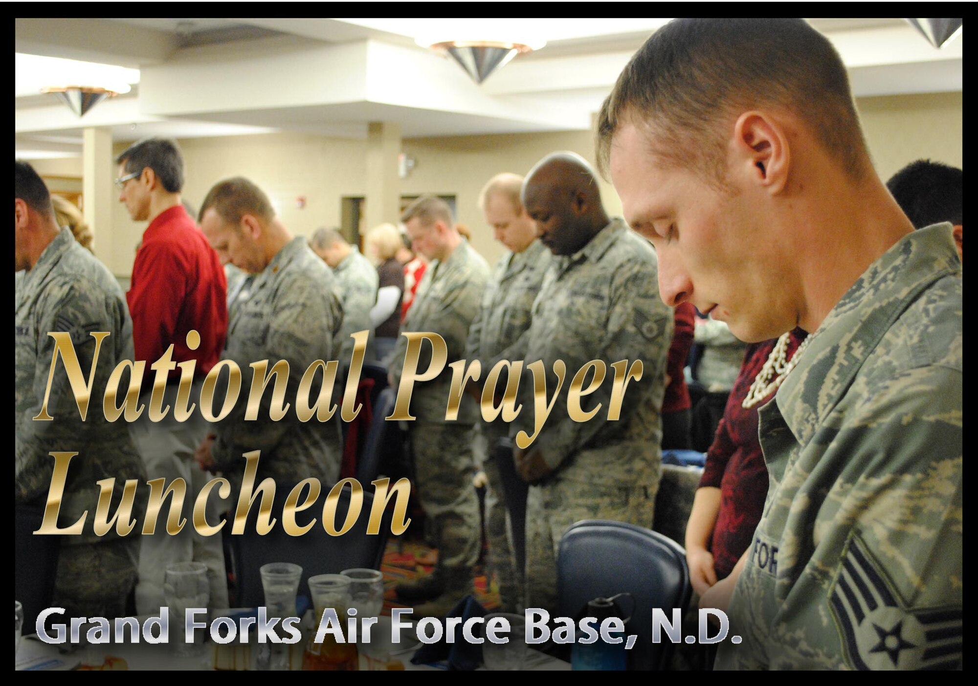 With bowed heads, guests stand silently while Chaplain (Maj. ) Craig Benson leads a prayer during the National Prayer Luncheon hosted by the 319th Air Base Wing Chaplain Office Jan. 30, 2013, at the Northern Lights Club on Grand Forks Air Force Base, N.D.  (U.S. Air Force photo illustration/Senior Airman Luis Loza Gutierrez)