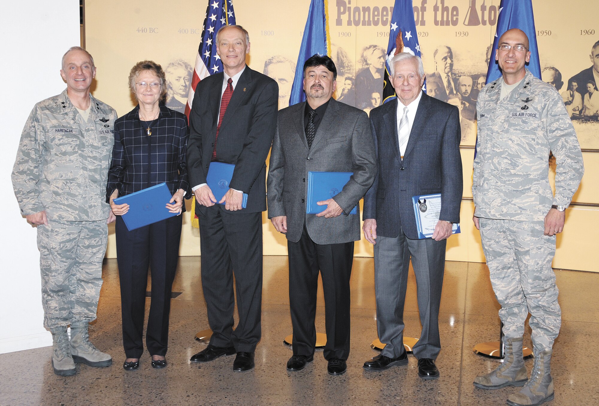 Maj. Gen. Garrett Harencak, Air Force Nuclear Weapons Center commander, left, inducted a new class of five “Order of the Nucleus” recipients Jan. 24 at the National Museum of Nuclear Science & History. The “Order of the Nucleus” is an AFNWC award presented to those who are supporting and have supported the nuclear enterprise with great distinction. Dr. Carolyne Hart, second from left, retired from an illustrious 33-year career at Sandia National Laboratories. David Seely, third from left, has led Kirtland Federal Credit Union in Albuquerque as president and CEO since 1990. Gabriel Herrera, center, of the 898th Munitions Squadron, has supported the Kirtland Underground Munitions Maintenance and Storage Complex for more than 20 years. Bill Patterson, second from right, is a U.S. Air Force veteran of the Korean War who retired after a 37-year career at SNL. Maj. Gen. Terrence A. “Terry” Feehan, right, is vice commander, Space and Missile Systems Center, Los Angeles AFB, Calif.

Photo by Dennis Carlson. 
