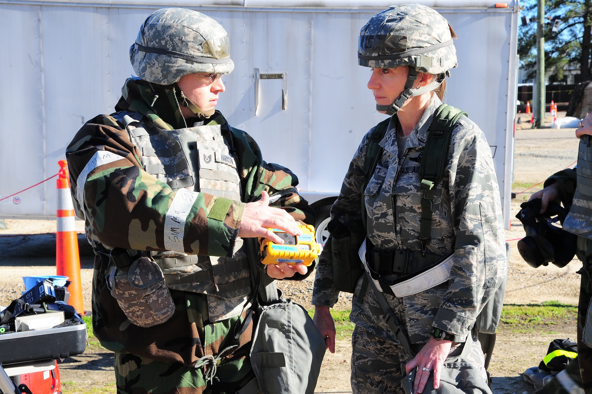 U.S. Air Force Tech. Sgt. James Harrison, 4th Civil Engineer Squadron emergency manager, briefs Col. Jeannie Leavitt, 4th Fighter Wing commander, on emergency management readiness equipment during Operational Readiness Exercise Coronet Warrior 13-01B, at a simulated deployed location on Seymour Johnson Air Force Base, N.C., Jan. 31, 2013. Leavitt visited Base X to get a first-hand look of what goes on to ensure mission success. (U.S. Air Force photo/Airman 1st Class Aubrey White/Released)