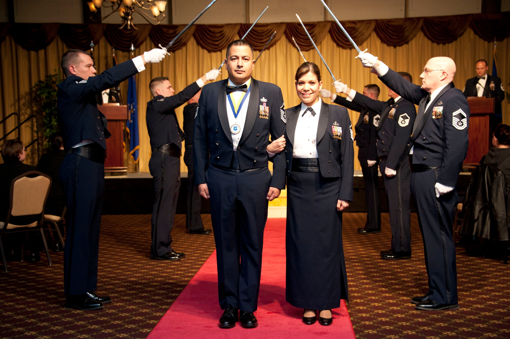 Master Sgts. Don Pedro, 305th Maintenance Squadron first sergeant, and Leida Pedro, 87th Air Base Wing Command Section superintendent, walk down the nominee carpet Jan. 25th, 2013, at the 305th Air Mobility Wing awards banquet at Joint Base McGuire-Dix-Lakehurst, N.J. Don Pedro was nominated for best first sergeant of the year and was announced the winner of the category later in the evening. Visit http://bit.ly/11eCtha to view more photos from the event. (U.S. Air Force photo by Airman Sean Crowe/Released)