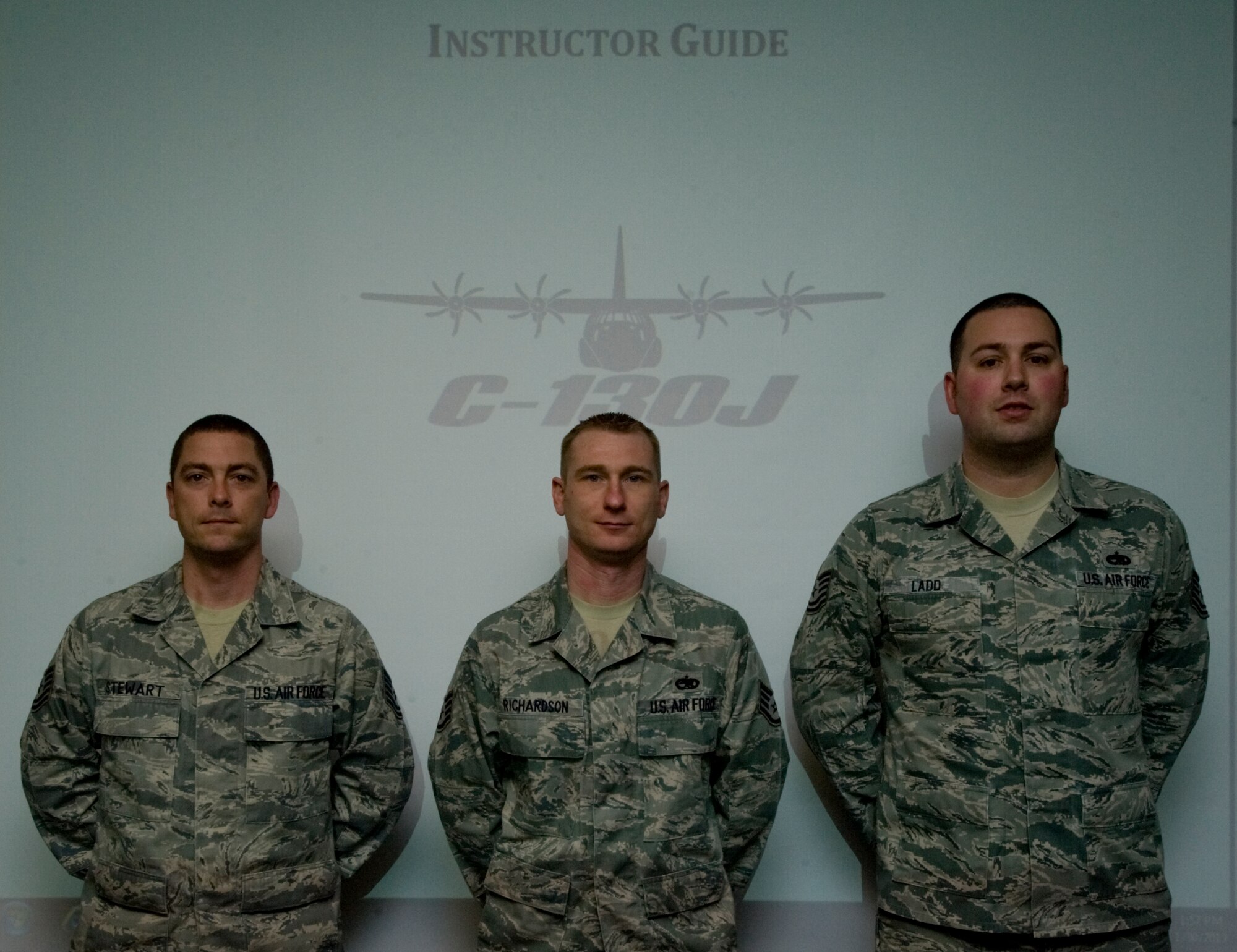 Tech. Sgt. Bradley Stewart, left, Staff Sgt. Roger Richardson, middle, and Tech. Sgt. Timothy Ladd, right, from the 317th Maintenance Operations Squadron, stand in front of a C-130J instructor guide Jan. 31, 2013, at Dyess Air Force Base, Texas. During the transition from the C-130H to the C-130J, Airmen were unable to get the proper training at needed due to multiple restraints. But due to the efforts of Stewart, Richardson and Ladd, the training is now available here, saving the Air Force 1,500 man-hours and approximately $45,000 annually. (U.S. Air Force photo by Airman 1st Class Jonathan Stefanko/ Released)