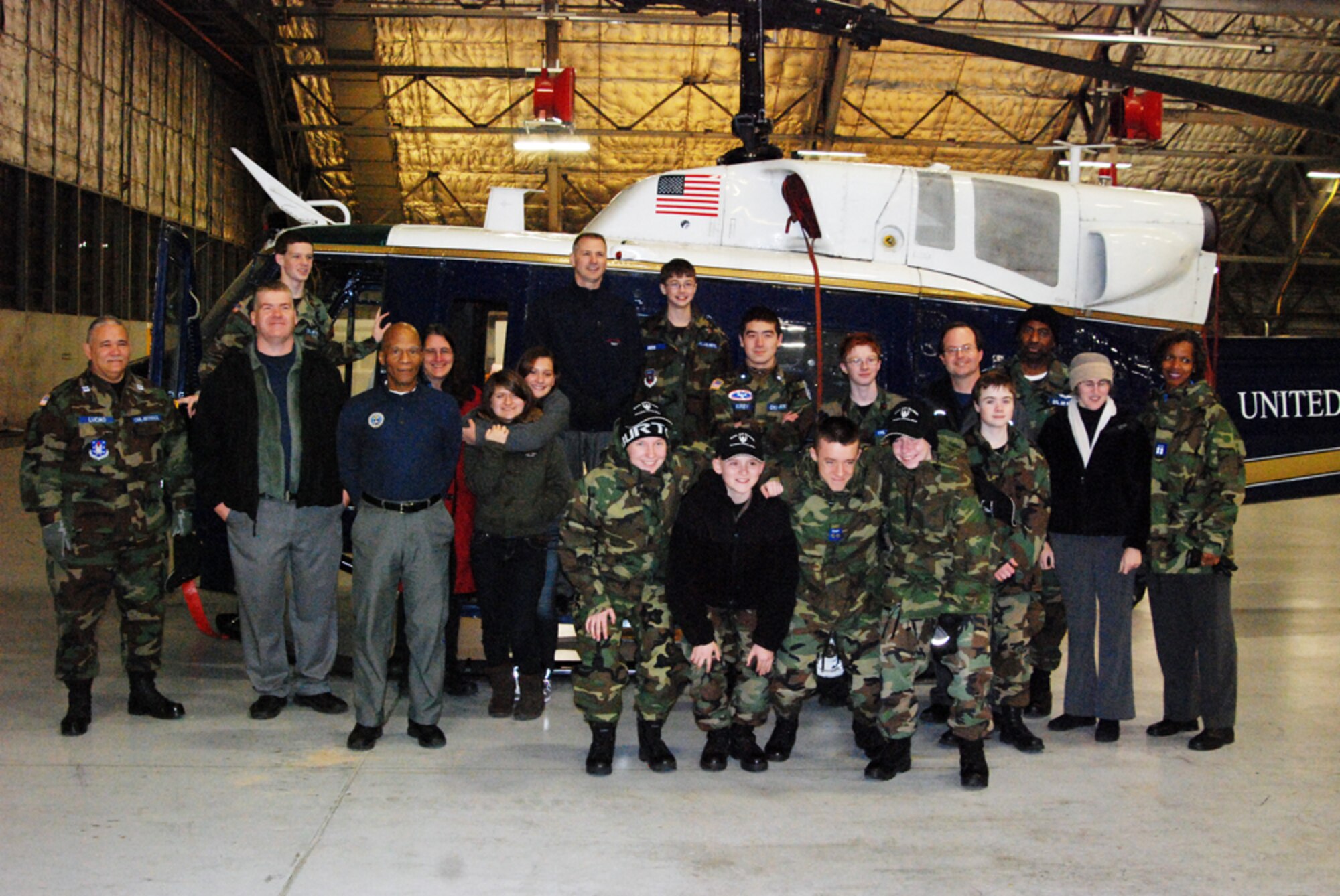 The National Capital Wing Civil Air Patrol cadets and the Girl Scout Council Nation’s Capital pose for a group photo during their tour of the 1st Helicopter Squadron.  The cadets and scouts assisted National Capital Region Airmen in preparation for the 57th Presidential Inauguration Jan. 21, 2013. (U.S. Air Force photo/Aletha Frost) 