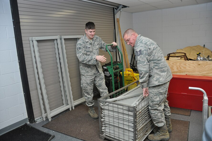 Senior Airman Benjamin St. Onge and Tech. Sgt. Andrew Smith, both from the 914th Force Support Squadron Services Sustainment Flight, begin to move into their newly renovated office building on the Niagara Falls Air Reserve Station, N.Y. January 5, 2013.  This remodeled building previously was used as the officer and enlisted club for many years and will now house several FSS organizations as well as a Civil Air Patrol unit.  (U.S. Air Force photo by Master Sgt. Kevin Nichols)