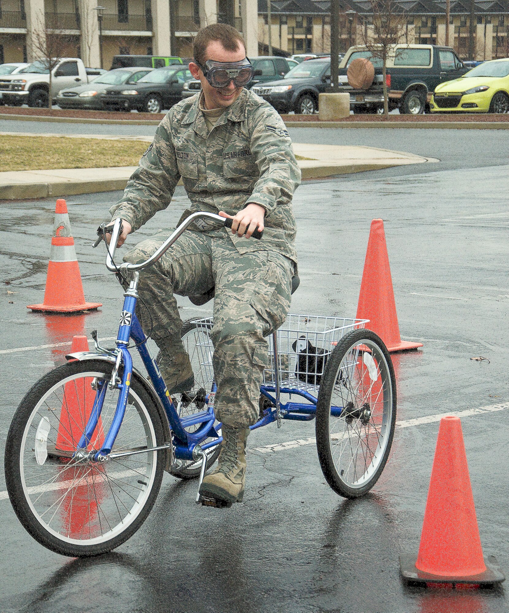 Airman 1st Class Justin Helton, 436th Aircraft Maintenance Squadron, attempts the tipsy tricycle at the safety send off for Super Bowl weekend (DUI Prevention) at the Patterson Dining Facility Jan. 30, 2013, at Dover Air Force Base, Del. The tipsy tricycle is where Airmen experience what it is like to drive a tricycle impaired using drunk goggles. (U.S. Air Force photo/Airman 1st Class Ashlin Federick) 