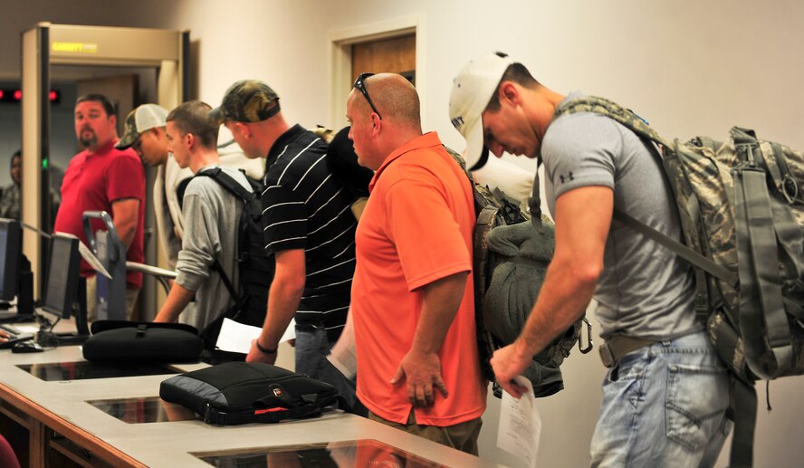 Airmen from the 23d Maintenance Group, 347th Rescue Group and 23d Logistics Readiness Squadron stand in line to out-process on Moody Air Force Base, Ga., Jan. 29, 2013.  After going through the out-processing line, they sat and waited to depart for deployment. (U.S. Air Force photo by Airman Alexis Grotz/Released)